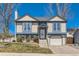 Charming two-story home featuring a well-manicured lawn, neutral siding, and an attached one car garage at 11437 W 103Rd Ave, Broomfield, CO 80021