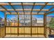 The screened porch provides a relaxing view of the fenced backyard and neighborhood at 11437 W 103Rd Ave, Broomfield, CO 80021