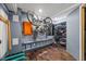Organized garage space with storage racks, tools, a ladder, and a place for bicycles at 1885 S Quebec Way # J106, Denver, CO 80231