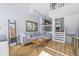 Cozy living room featuring a comfortable sectional couch, wood floors, and decorative accents at 1885 S Quebec Way # J106, Denver, CO 80231