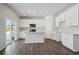 Well lit kitchen featuring white cabinets, stainless steel appliances and island at 1432 Orchard St, Brighton, CO 80601