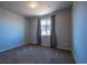 Bedroom featuring a gray interior, carpet flooring and a window at 26960 E Costilla Dr, Aurora, CO 80016