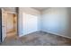 Bedroom with a closet and neutral colored carpet at 26960 E Costilla Dr, Aurora, CO 80016