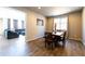 Dining room with wood table and views into the living room at 26960 E Costilla Dr, Aurora, CO 80016