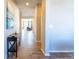 Inviting foyer with hardwood floors that transition into a living area with stylish furnishings at 26960 E Costilla Dr, Aurora, CO 80016