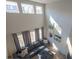 Elevated view of a modern living room with soaring ceilings, stylish decor, and comfortable seating at 26960 E Costilla Dr, Aurora, CO 80016