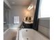 Main bathroom with a soaking tub and walk-in shower at 26960 E Costilla Dr, Aurora, CO 80016