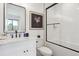Elegant bathroom featuring modern vanity, soaking tub and tiled shower with glass door at 1567 Arrowpoint Ct, Franktown, CO 80116