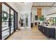 Inviting foyer showcasing a view of the living and kitchen area with modern decor at 1567 Arrowpoint Ct, Franktown, CO 80116