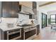 State-of-the-art kitchen featuring stainless steel range, white countertops, and ample cabinet space at 1567 Arrowpoint Ct, Franktown, CO 80116