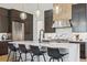 Well-appointed kitchen with an island, bar seating, and stainless steel appliances at 1567 Arrowpoint Ct, Franktown, CO 80116