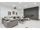 Finished basement living room with comfortable seating, modern fireplace and cozy decor at 1567 Arrowpoint Ct, Franktown, CO 80116