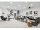 Spacious finished basement living area featuring projector, ample seating and a wet bar at 1567 Arrowpoint Ct, Franktown, CO 80116
