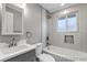 Bathroom featuring a shower-tub combo and modern design at 1003 N Jackson St, Golden, CO 80403