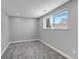 Cozy bedroom with neutral carpet, large window, and mountain views at 1003 N Jackson St, Golden, CO 80403