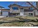 Charming two-story home featuring a brick and siding exterior with a well-manicured front yard at 1003 N Jackson St, Golden, CO 80403