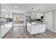 Modern kitchen with white cabinetry, stainless steel appliances, and granite countertops at 1003 N Jackson St, Golden, CO 80403