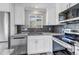 Kitchen with mountain view, stainless appliances, and granite counters at 1003 N Jackson St, Golden, CO 80403