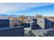 Aerial view of modern townhouses with rooftop decks and mountain views at 4391 Zenobia St, Denver, CO 80212