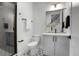 Modern bathroom with white vanity and patterned floor tiles at 4391 Zenobia St, Denver, CO 80212