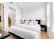 Bright bedroom with king-size bed and large windows at 4391 Zenobia St, Denver, CO 80212