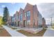 Modern brick townhouses with sleek design and private entrances at 4391 Zenobia St, Denver, CO 80212