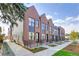 Modern brick townhouses with private patios and walkway at 4391 Zenobia St, Denver, CO 80212