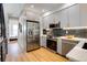 Modern kitchen with stainless steel appliances and island at 4391 Zenobia St, Denver, CO 80212