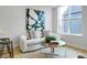 Bright living room with white couch and wooden coffee table at 4391 Zenobia St, Denver, CO 80212