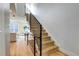 Modern staircase with metal railing and light wood at 4391 Zenobia St, Denver, CO 80212