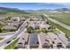 Scenic aerial view of a suburban neighborhood featuring well-spaced homes and a nearby highway at 19780 W 57Th Ln, Golden, CO 80403