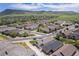 Beautiful aerial view of residential neighborhood featuring well-maintained homes and landscaping with mountains in the distance at 19780 W 57Th Ln, Golden, CO 80403