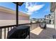 Outdoor deck area with a grill and lounge seating, perfect for relaxation and entertaining with neighborhood views at 19780 W 57Th Ln, Golden, CO 80403