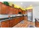 Spacious kitchen with stainless steel appliances, granite counters and warm wood cabinetry at 19780 W 57Th Ln, Golden, CO 80403