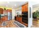 Spacious kitchen with stainless steel appliances, granite counters and warm wood cabinetry at 19780 W 57Th Ln, Golden, CO 80403