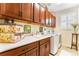 Functional laundry room featuring lots of cabinet space, a sink, a folding counter, and modern washer and dryer units at 19780 W 57Th Ln, Golden, CO 80403