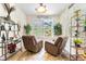 Cozy sitting room with comfortable chairs, natural light, and plantation shutters at 19780 W 57Th Ln, Golden, CO 80403