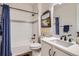 Well-lit bathroom featuring a bathtub with a tiled wall accent and a modern vanity at 1784 Cade Ave, Castle Rock, CO 80104