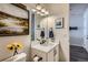Bright bathroom features modern vanity, mirror and updated fixtures at 1784 Cade Ave, Castle Rock, CO 80104