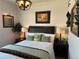 Comfortable bedroom with decorative pillows, lamps, and artistic wall décor at 1784 Cade Ave, Castle Rock, CO 80104