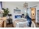 Inviting bedroom features hardwood floors, natural light, and ensuite bathroom at 1784 Cade Ave, Castle Rock, CO 80104