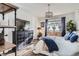 Comfortable bedroom with hardwood floors, natural light, and dresser at 1784 Cade Ave, Castle Rock, CO 80104