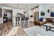 Open kitchen with white cabinets, stainless steel appliances, and a breakfast bar at 1784 Cade Ave, Castle Rock, CO 80104