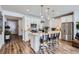 Bright kitchen featuring a center island with seating, stainless appliances, and ample cabinet space at 1784 Cade Ave, Castle Rock, CO 80104