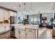 Bright kitchen with white countertops, a farmhouse sink, and stainless steel appliances at 1784 Cade Ave, Castle Rock, CO 80104