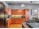 Modern kitchen with wood cabinets and stainless steel appliances at 1801 Wynkoop St # 205, Denver, CO 80202