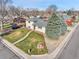 Aerial view of home featuring mature trees, green lawn, and close proximity to local roads at 2488 S Zurich Ct, Denver, CO 80219