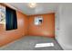 Bedroom with carpet, neutral walls, window and closet at 2488 S Zurich Ct, Denver, CO 80219