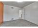 Bedroom featuring a closet and view to the stairs at 2488 S Zurich Ct, Denver, CO 80219