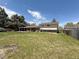 Large backyard and covered patio with view of the home's back exterior at 1822 Ura Ln, Northglenn, CO 80234